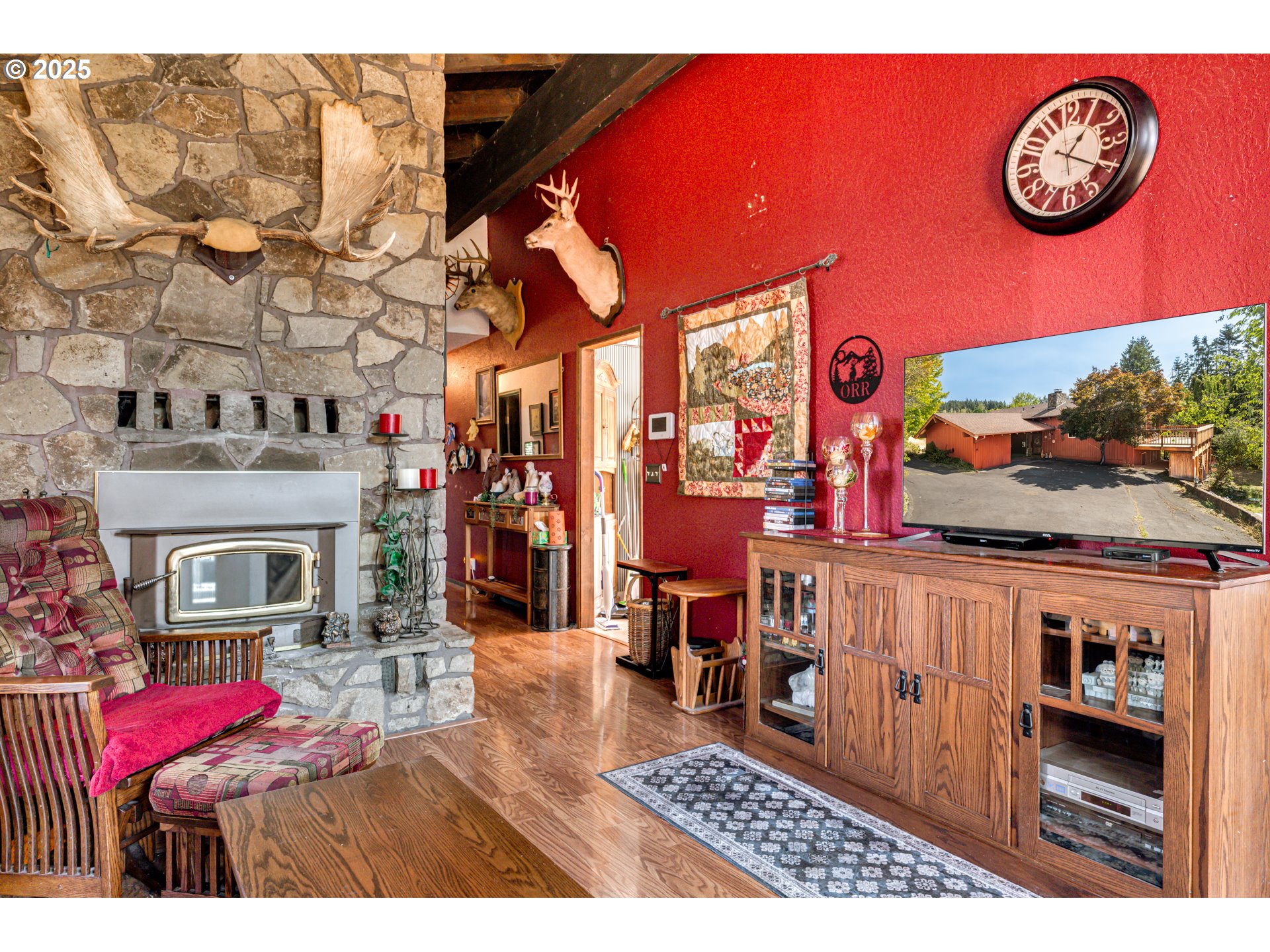 1415 Cloverdale Road Kalama, WA 98625 - Photo 5 of 39 a living room with furniture a flat screen tv and a fireplace