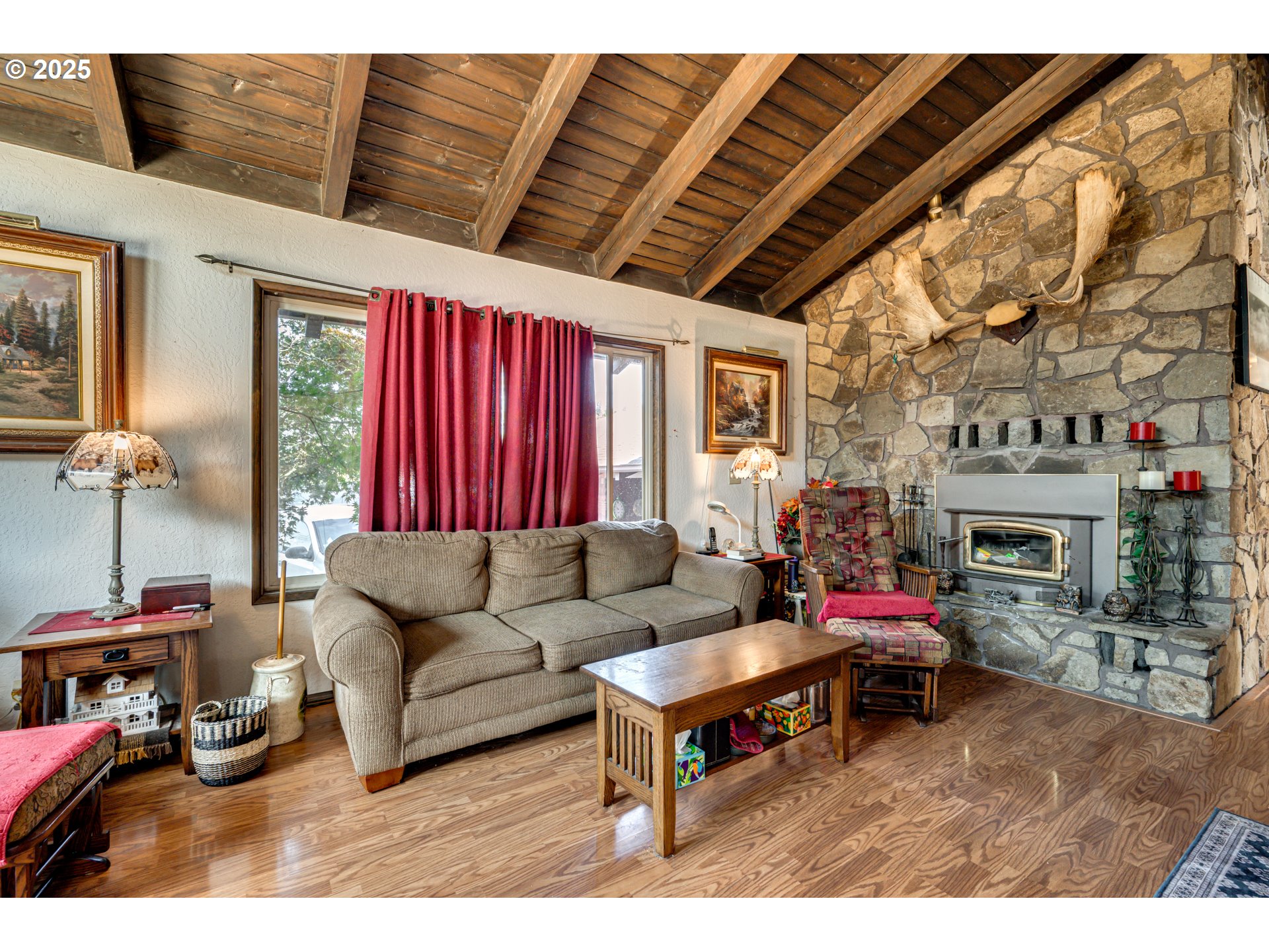 1415 Cloverdale Road Kalama, WA 98625 - Photo 6 of 39 a living room with furniture a fireplace and a window