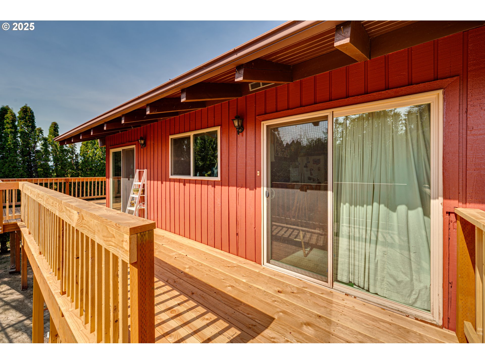 1415 Cloverdale Road Kalama, WA 98625 - Photo 9 of 39 a view of a house with wooden fence