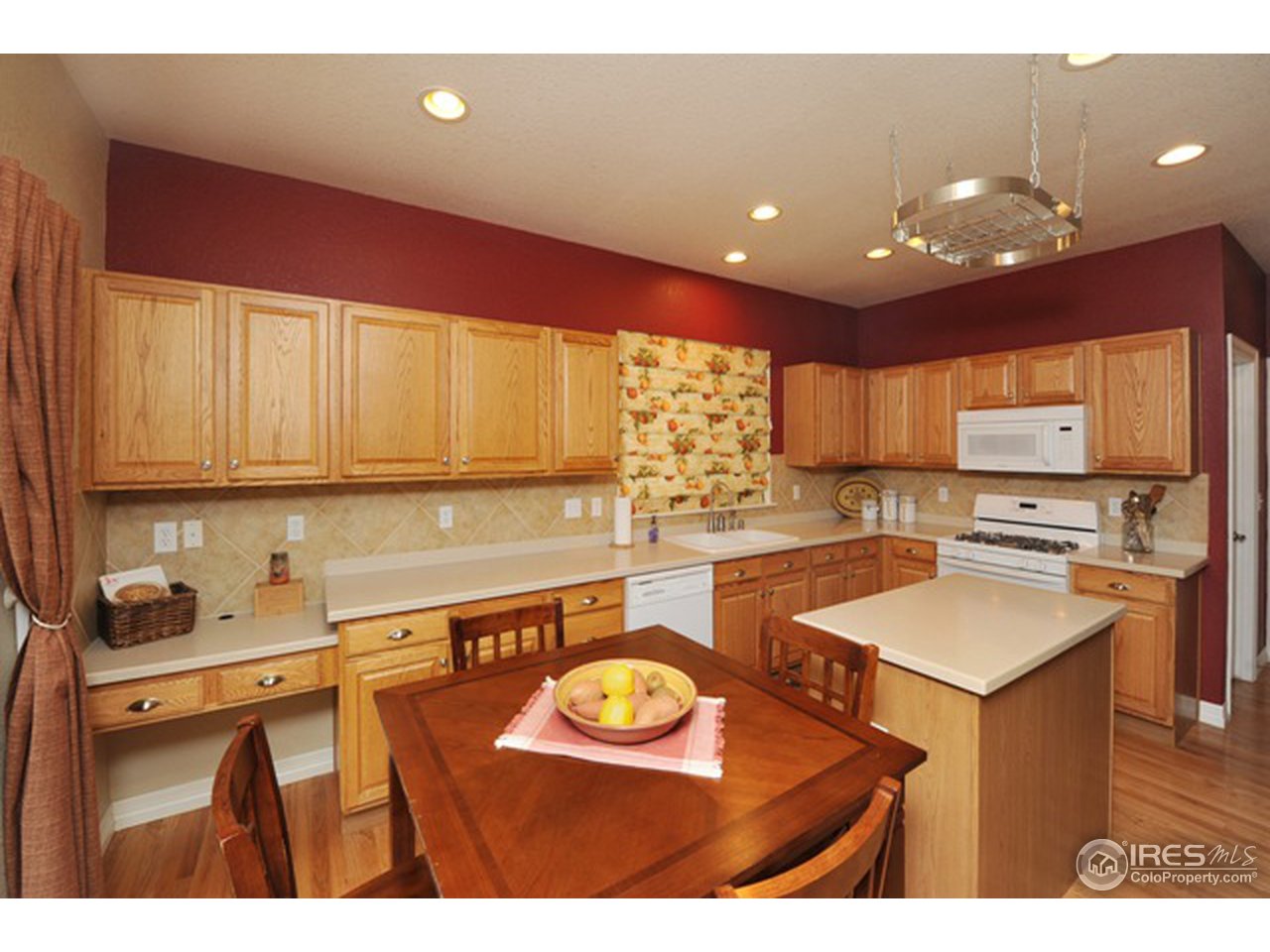 609 Americana Road Longmont, CO 80504 - Photo 9 of 25 Kitchen is open to family room