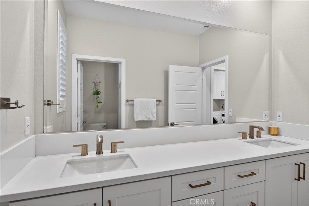 382 Chorus Irvine, CA 92618 - Photo 23 of 38 a bathroom with a sink and a mirror