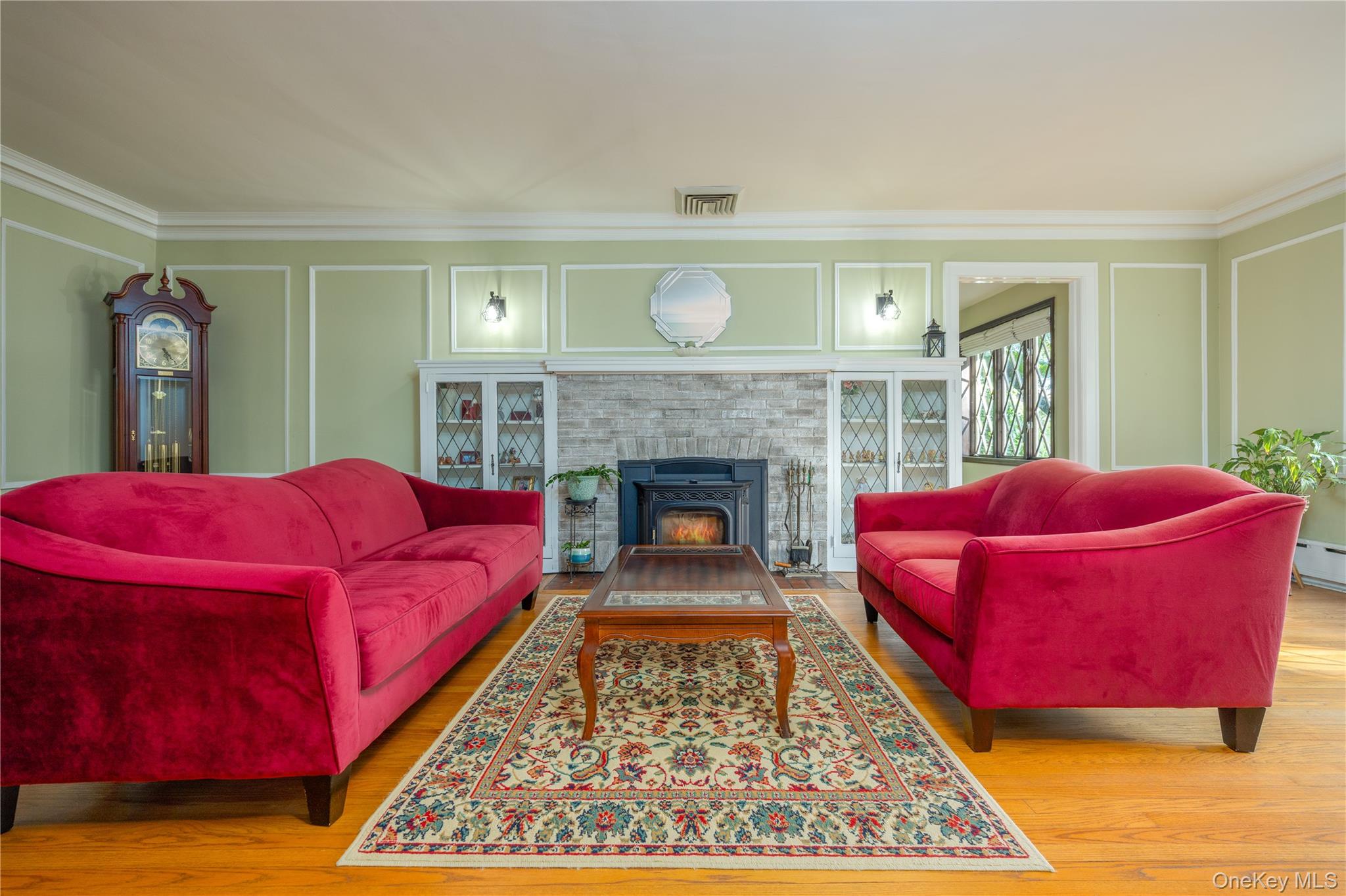 159 Fenimore Road New Rochelle, NY 10804 - Photo 4 of 37 Formal living room with custom built-ins surrounding the fireplace, currently keeping your heating bills low with a pellet fireplace