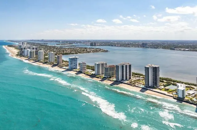 a view of a terrace with lawn chairs