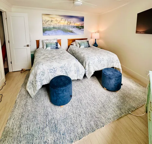 a bathroom with a glass door shower and toilet