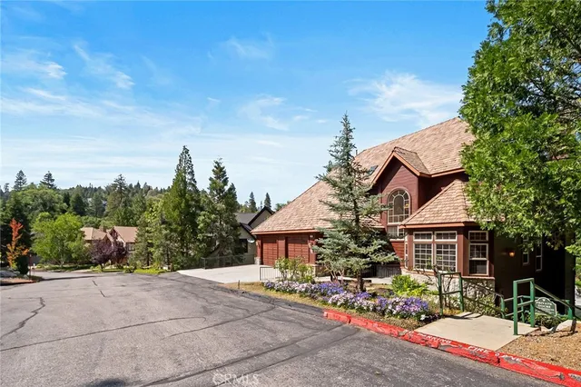 a view of a dining room with furniture large windows and wooden floor