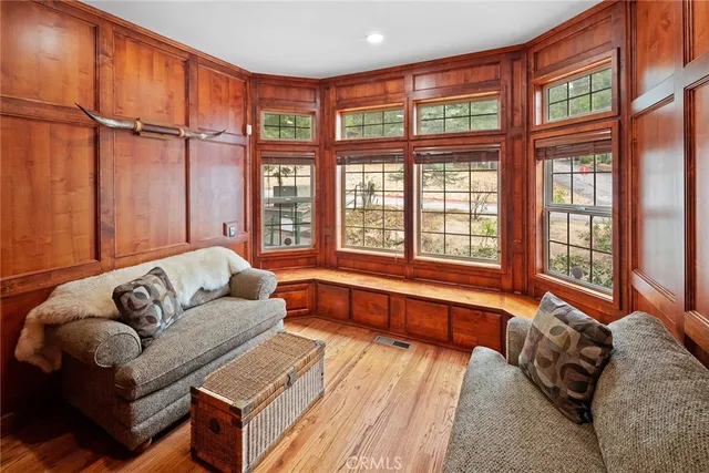 a spacious bedroom with a large bed and a large window