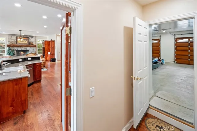 a bedroom with a bed and a dresser with mirror