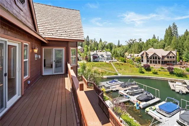 a large bedroom with a large bed and large windows