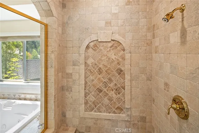 a view of a bedroom with cabinet and mirror