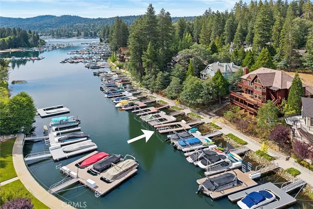 a view of a balcony with chairs and a fire pit