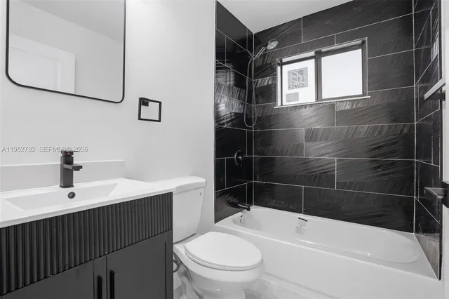 a kitchen with stainless steel appliances a sink and cabinets