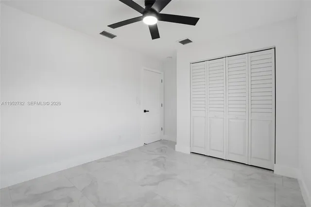 a bathroom with a toilet sink and shower