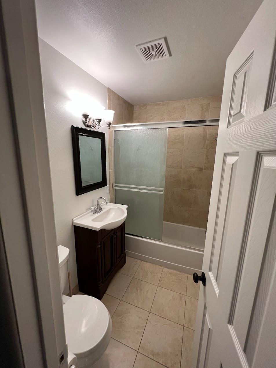 1205 F Street Reedley, CA 93654 - Photo 12 of 34 a bathroom with a sink toilet and shower