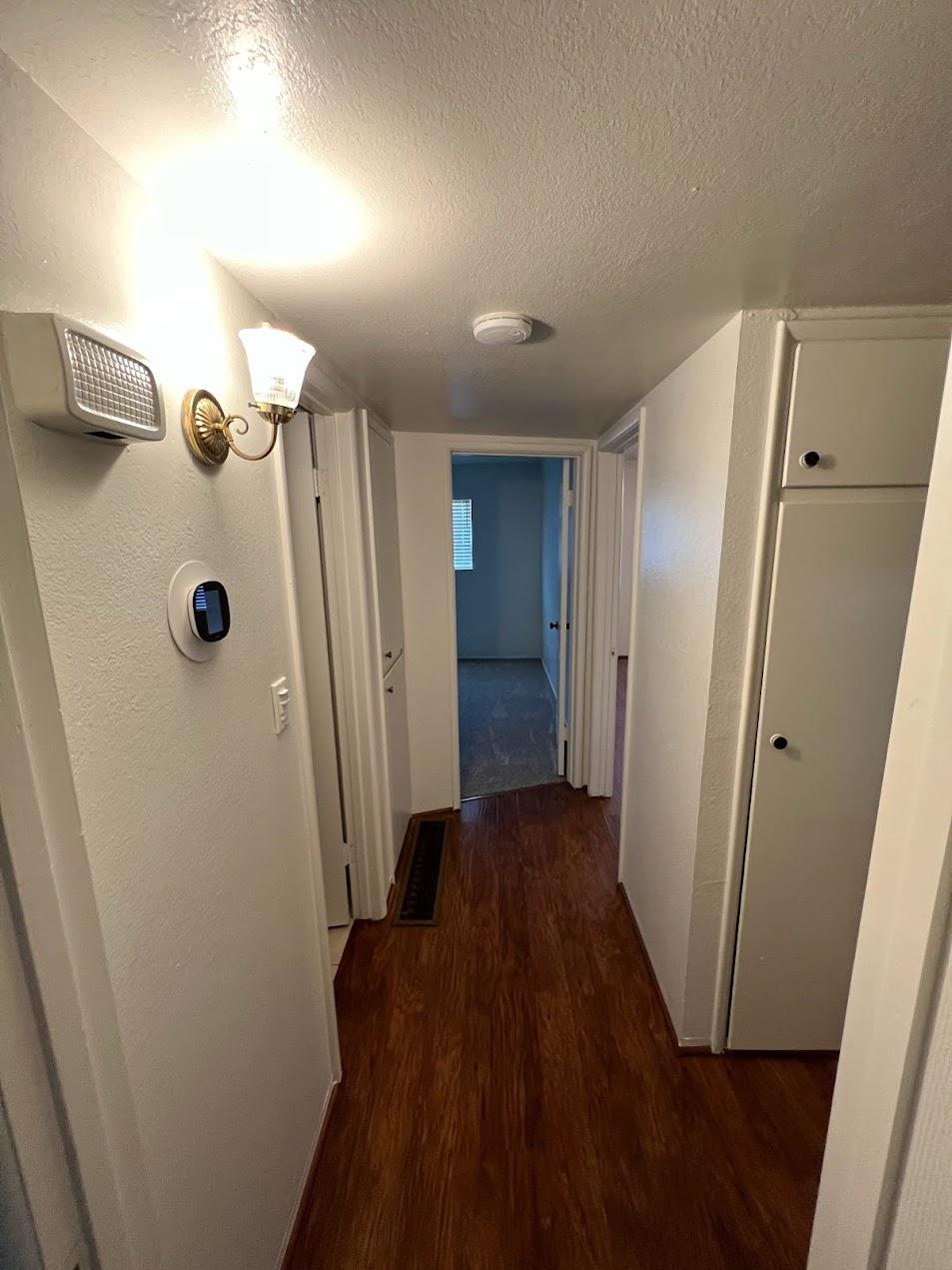 1205 F Street Reedley, CA 93654 - Photo 16 of 34 a view of a hallway with wooden floor