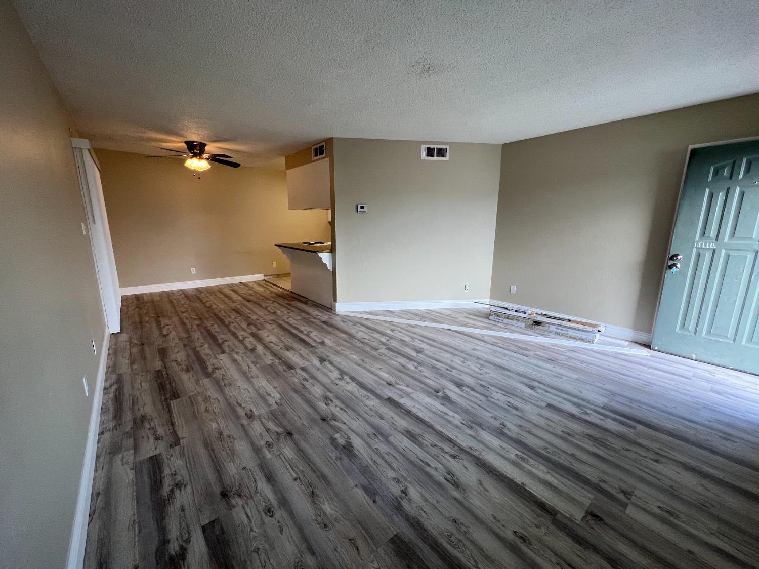 1205 F Street Reedley, CA 93654 - Photo 22 of 34 a view of an empty room with wooden floor