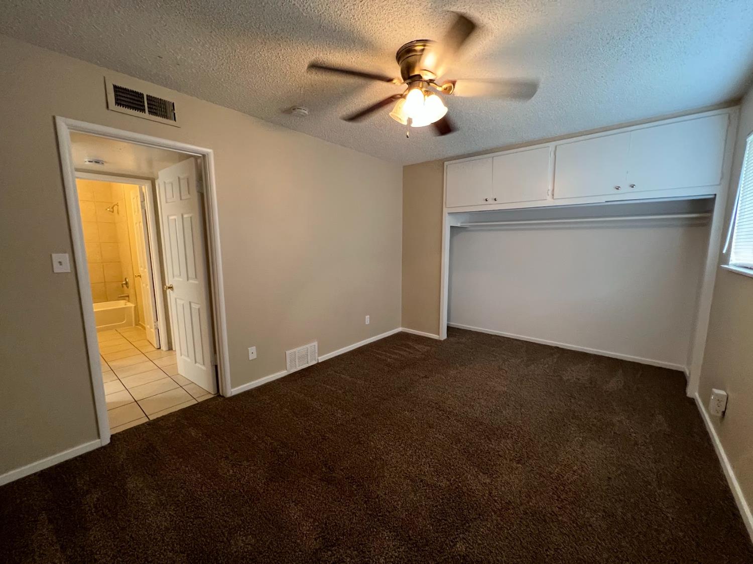 1205 F Street Reedley, CA 93654 - Photo 29 of 34 a view of an empty room with a window