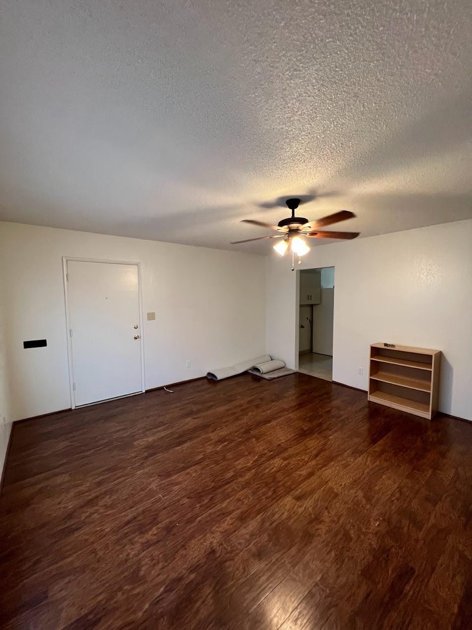 1205 F Street Reedley, CA 93654 - Photo 10 of 34 a view of empty room with wooden floor