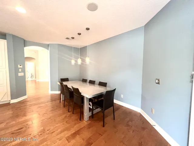 a room with furniture and wooden floor