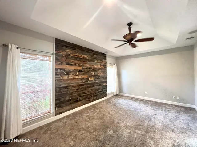 a view of an empty room and a window