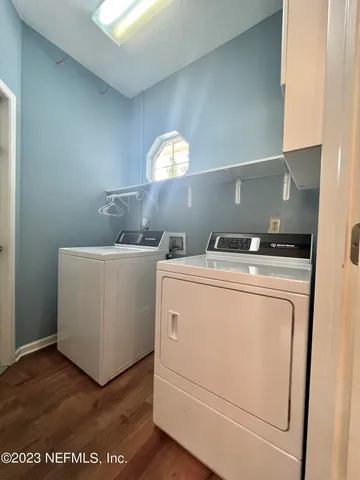 a utility room with dryer and washer
