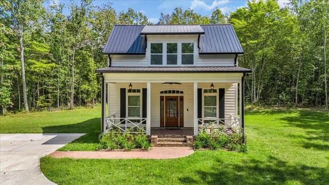 front view of a house with a yard