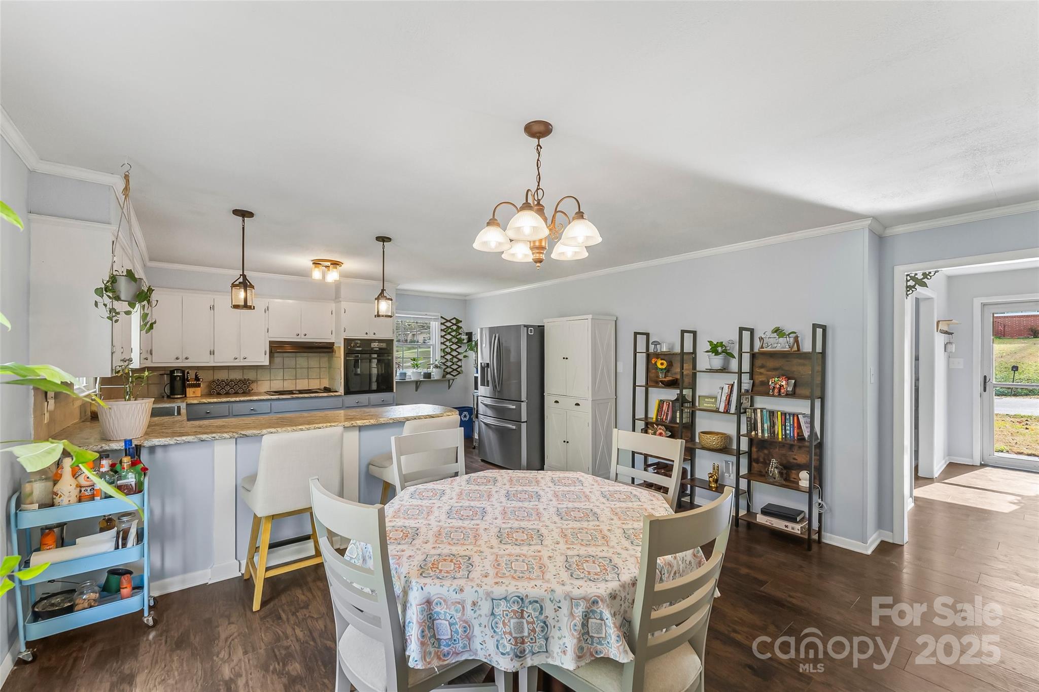 320 Morehead St Extension Morganton, NC 28655 - Photo 12 of 33 a dining room with furniture and chandelier