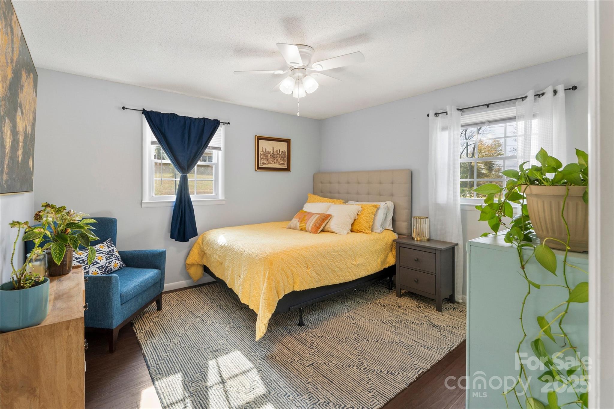 320 Morehead St Extension Morganton, NC 28655 - Photo 17 of 33 a bedroom with a bed potted plant and a window