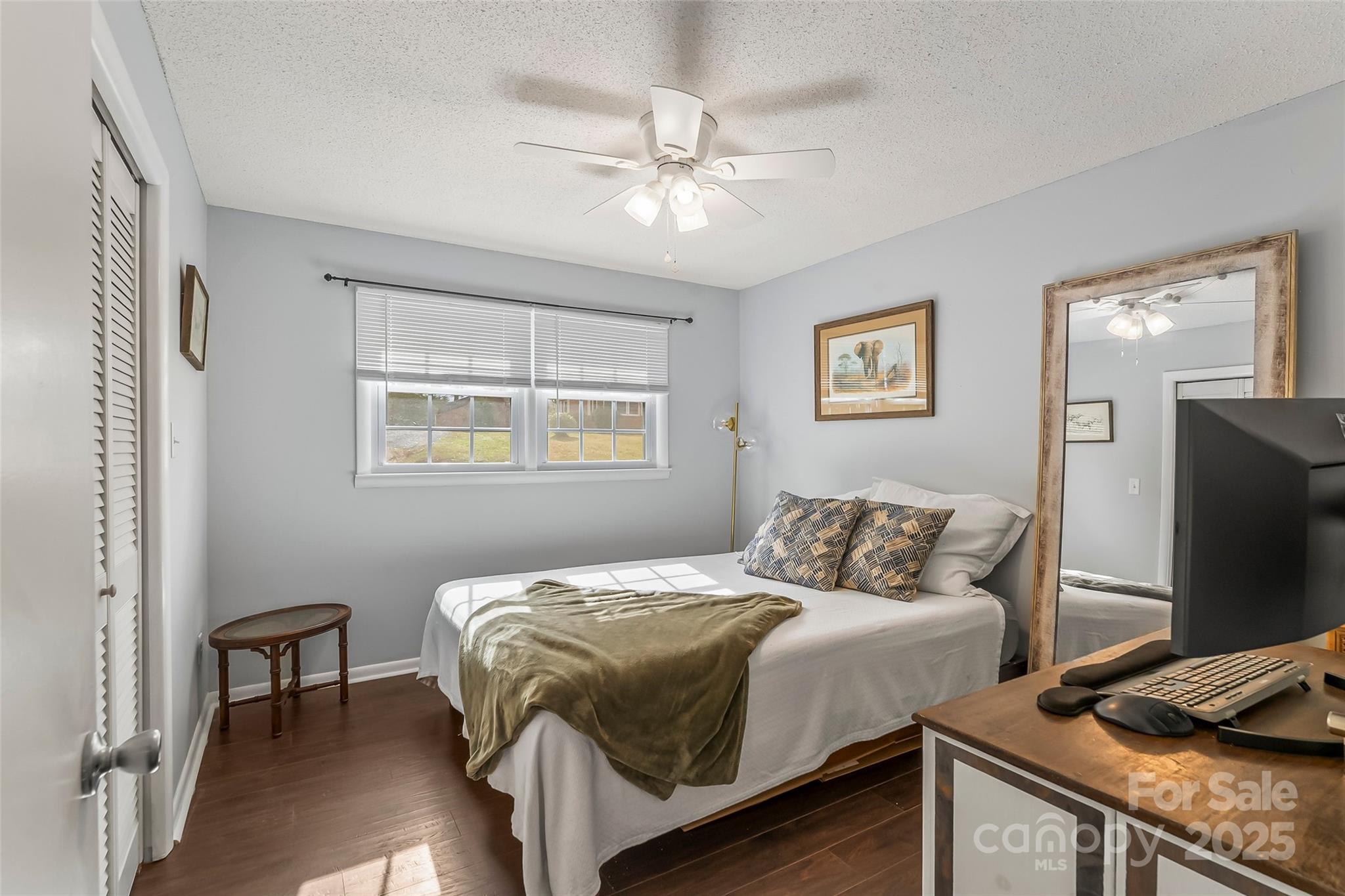 320 Morehead St Extension Morganton, NC 28655 - Photo 18 of 33 a bedroom with a bed and a flat screen tv