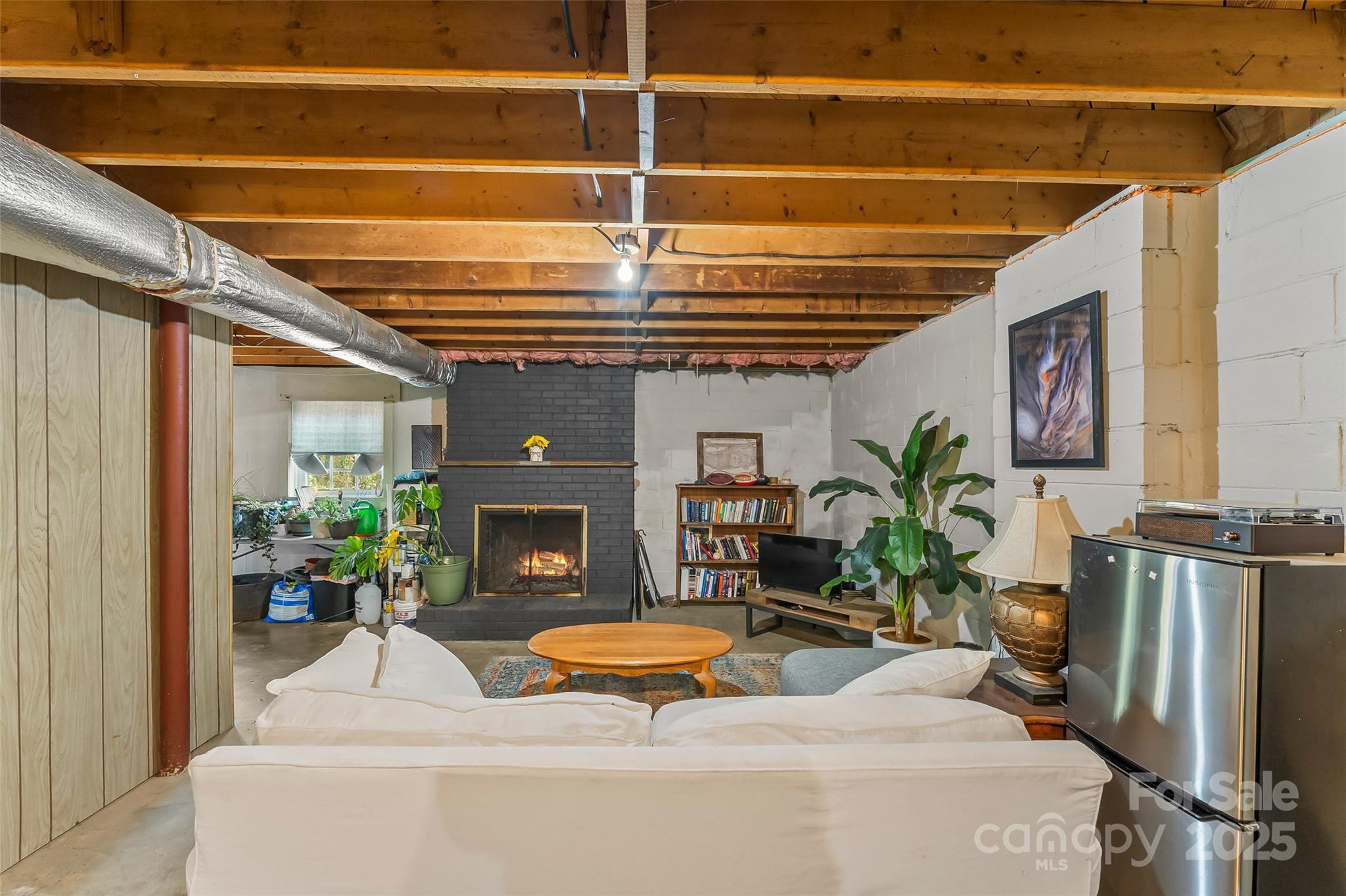 320 Morehead St Extension Morganton, NC 28655 - Photo 20 of 33 a living room with patio furniture and a fireplace