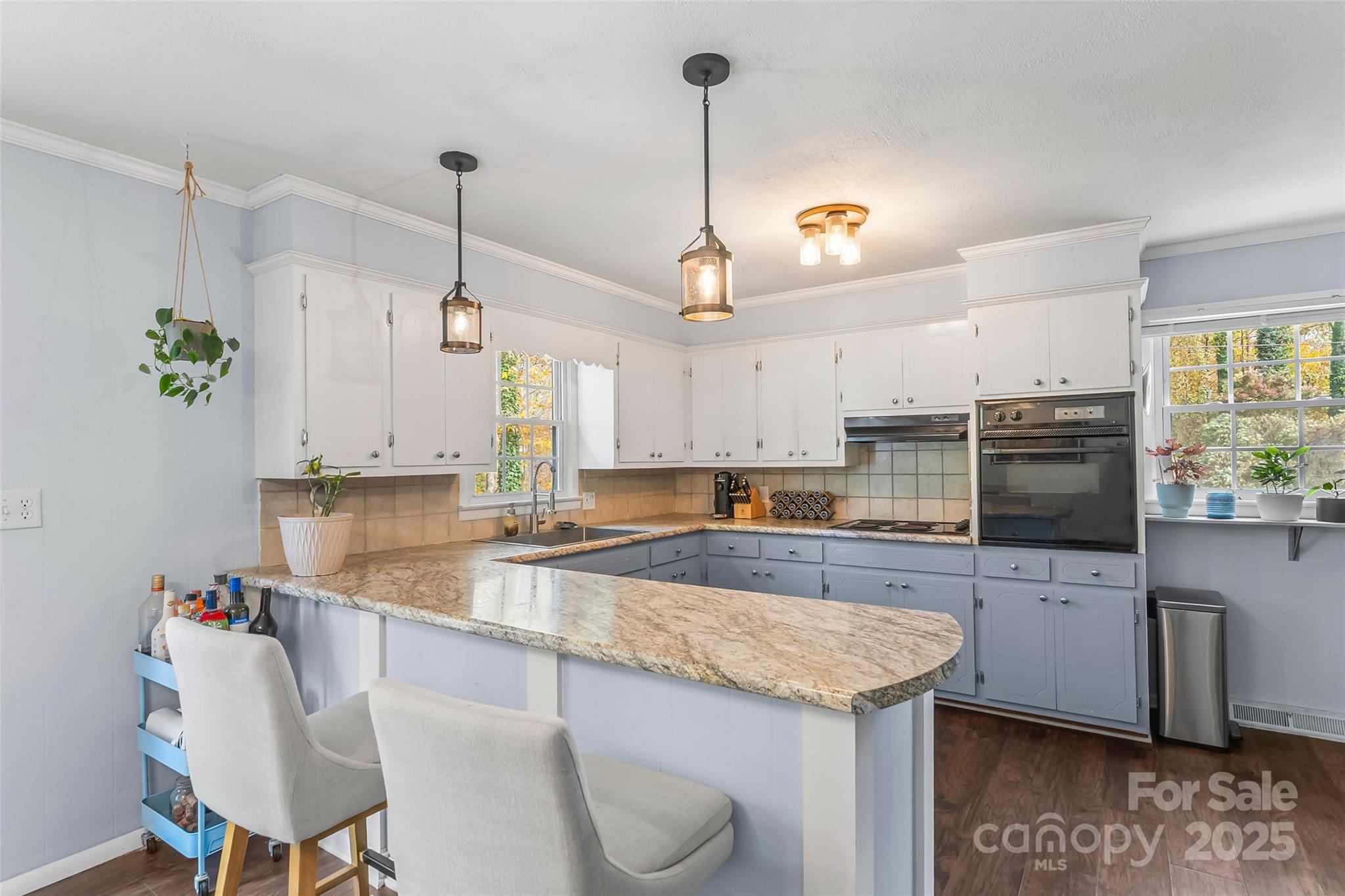 320 Morehead St Extension Morganton, NC 28655 - Photo 7 of 33 a kitchen with a sink a counter top space cabinets and stainless steel appliances