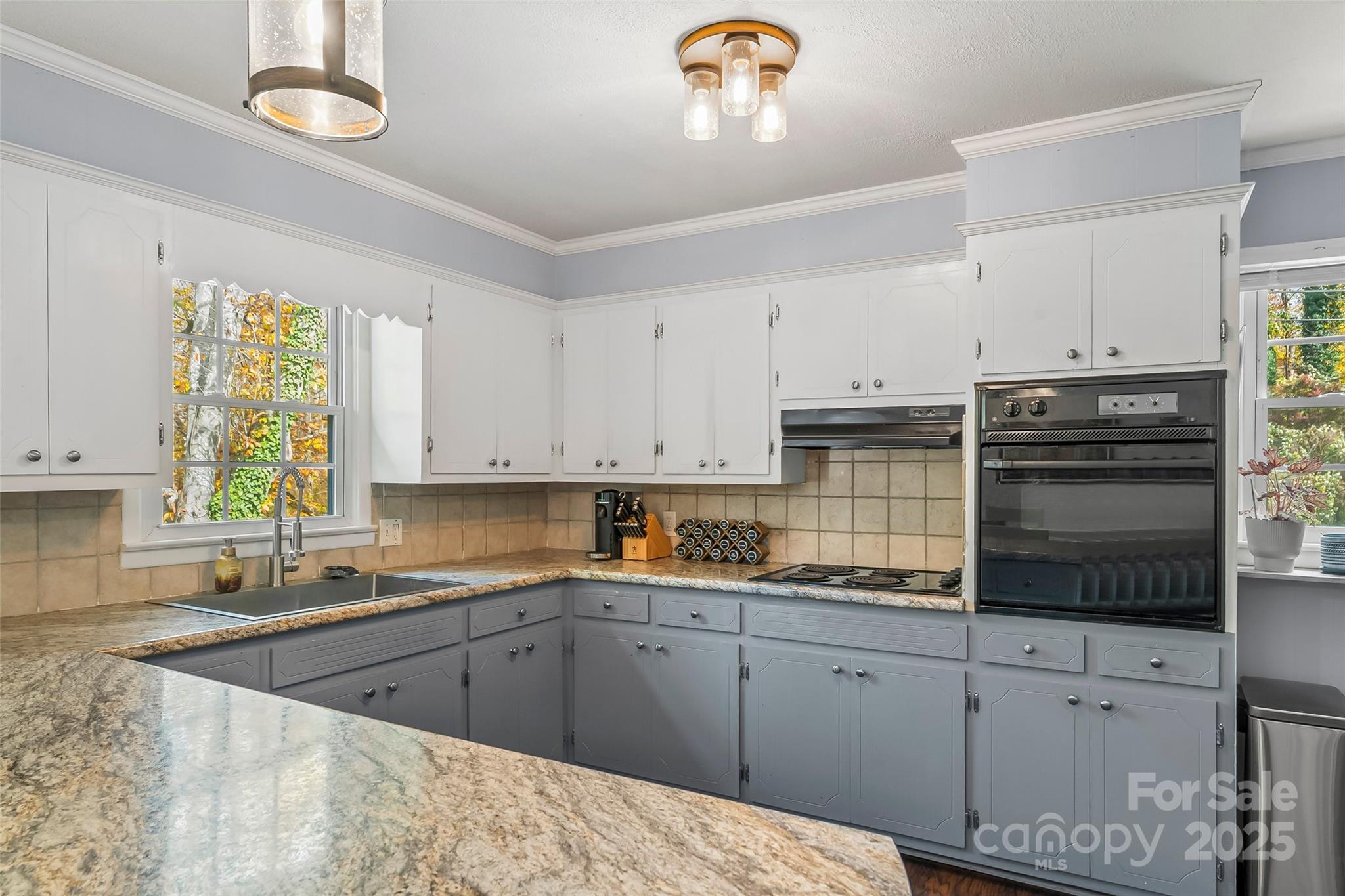 320 Morehead St Extension Morganton, NC 28655 - Photo 8 of 33 a kitchen with cabinets and window