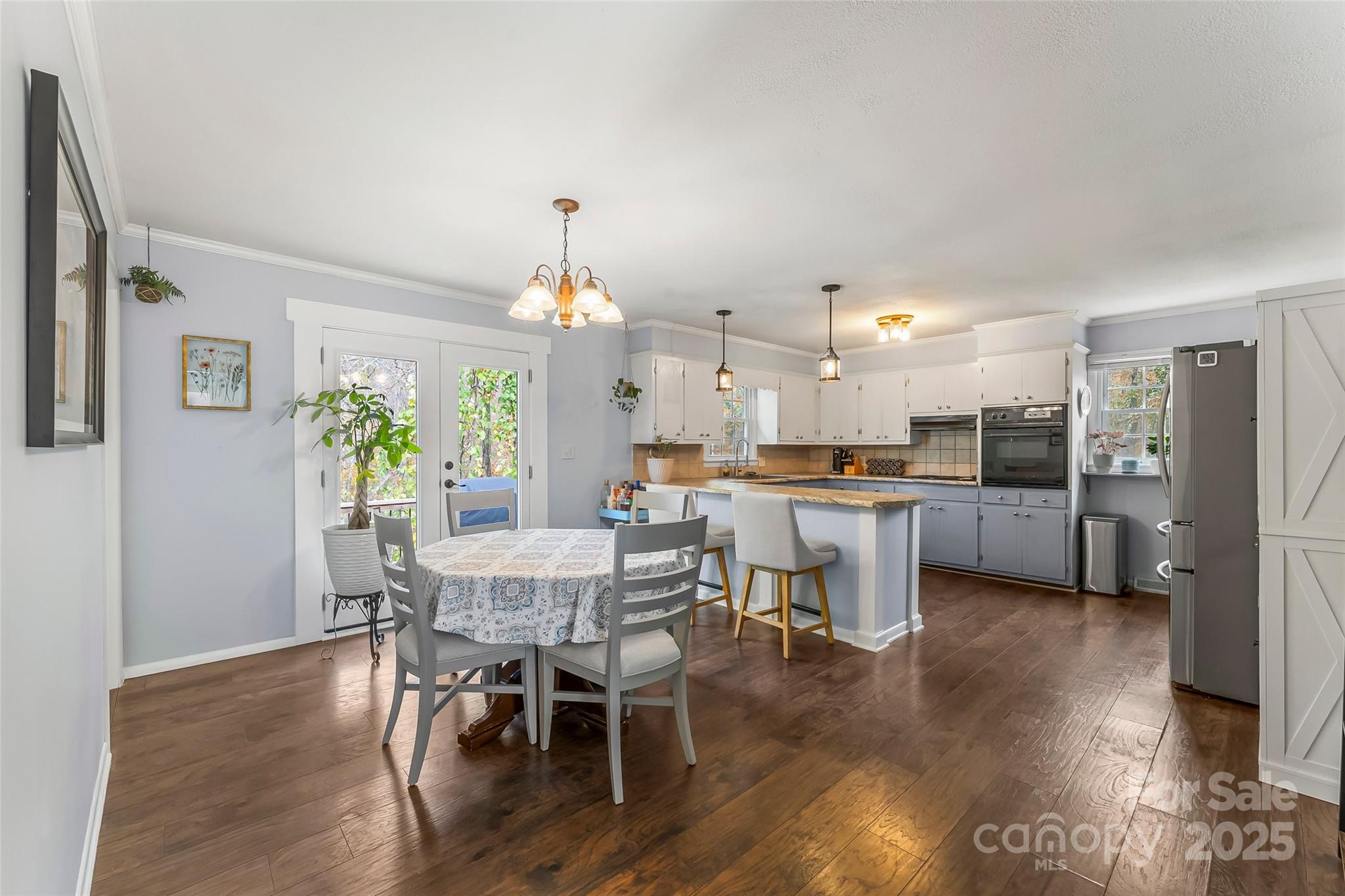 320 Morehead St Extension Morganton, NC 28655 - Photo 10 of 33 a view of a dining room with furniture and wooden floor