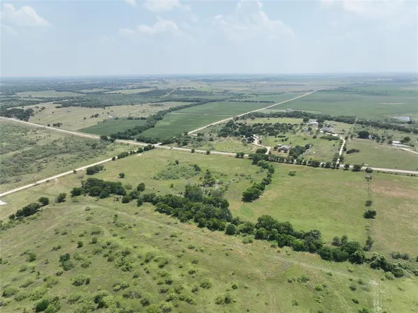 a view of a field with an outdoor space