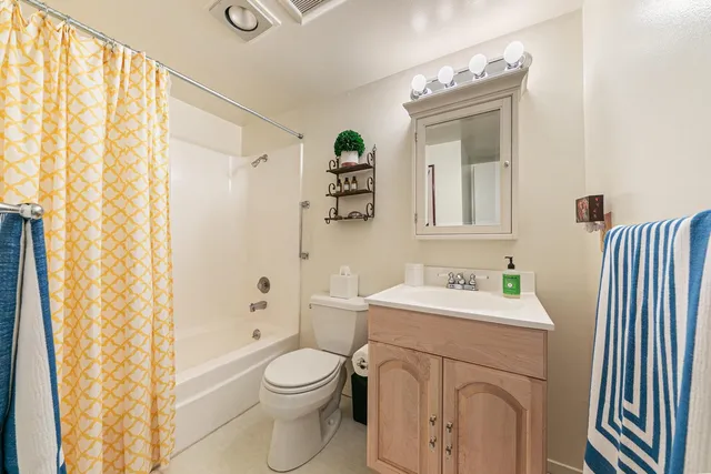 a view of a balcony with wooden chairs
