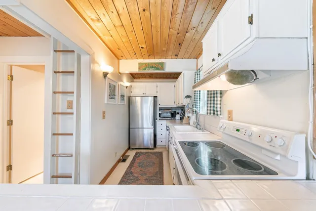 a living room with furniture fireplace and flat screen tv