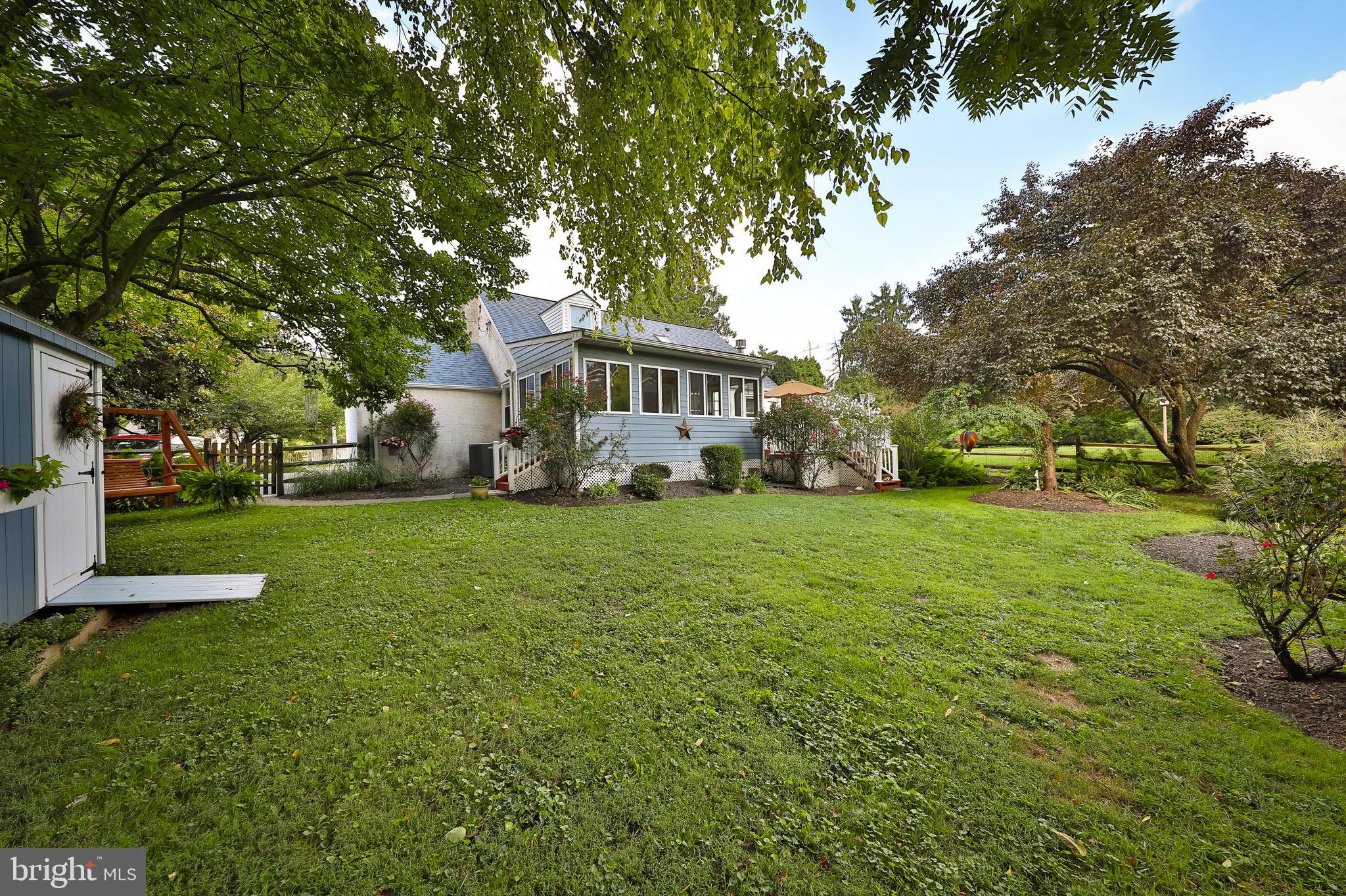 1702 Church Road Oreland, PA 19075 - Photo 23 of 28 a front view of a house with a yard tree and green space