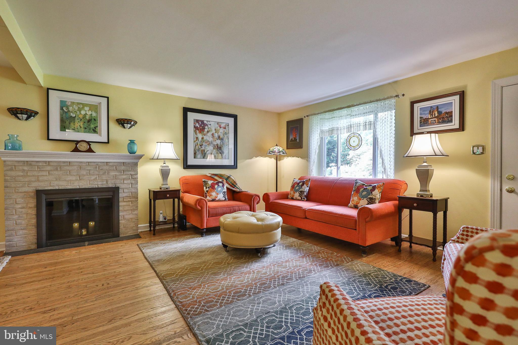 1702 Church Road Oreland, PA 19075 - Photo 5 of 28 a living room with furniture and a fireplace