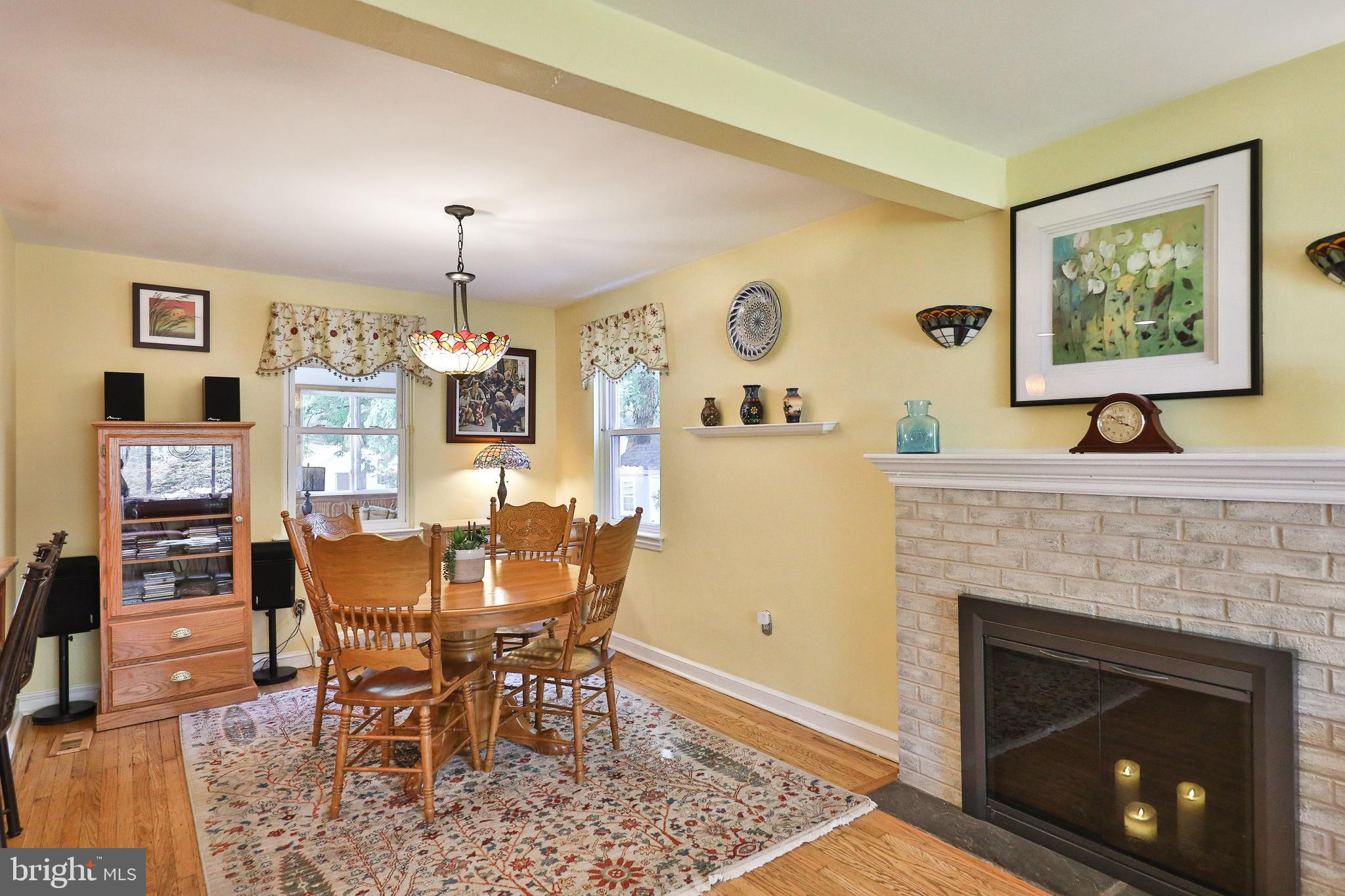 1702 Church Road Oreland, PA 19075 - Photo 7 of 28 a view of a dining room with furniture and chandelier
