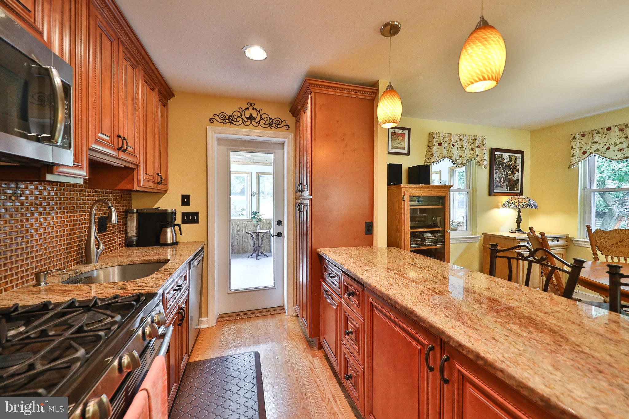 1702 Church Road Oreland, PA 19075 - Photo 10 of 28 a kitchen with stainless steel appliances granite countertop a stove and a sink