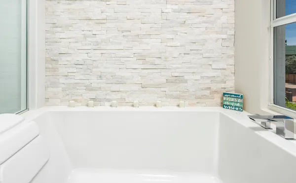 a view of a house with swimming pool and sitting area