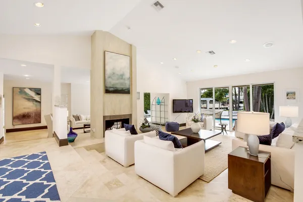 a view of a room with wooden floor and windows
