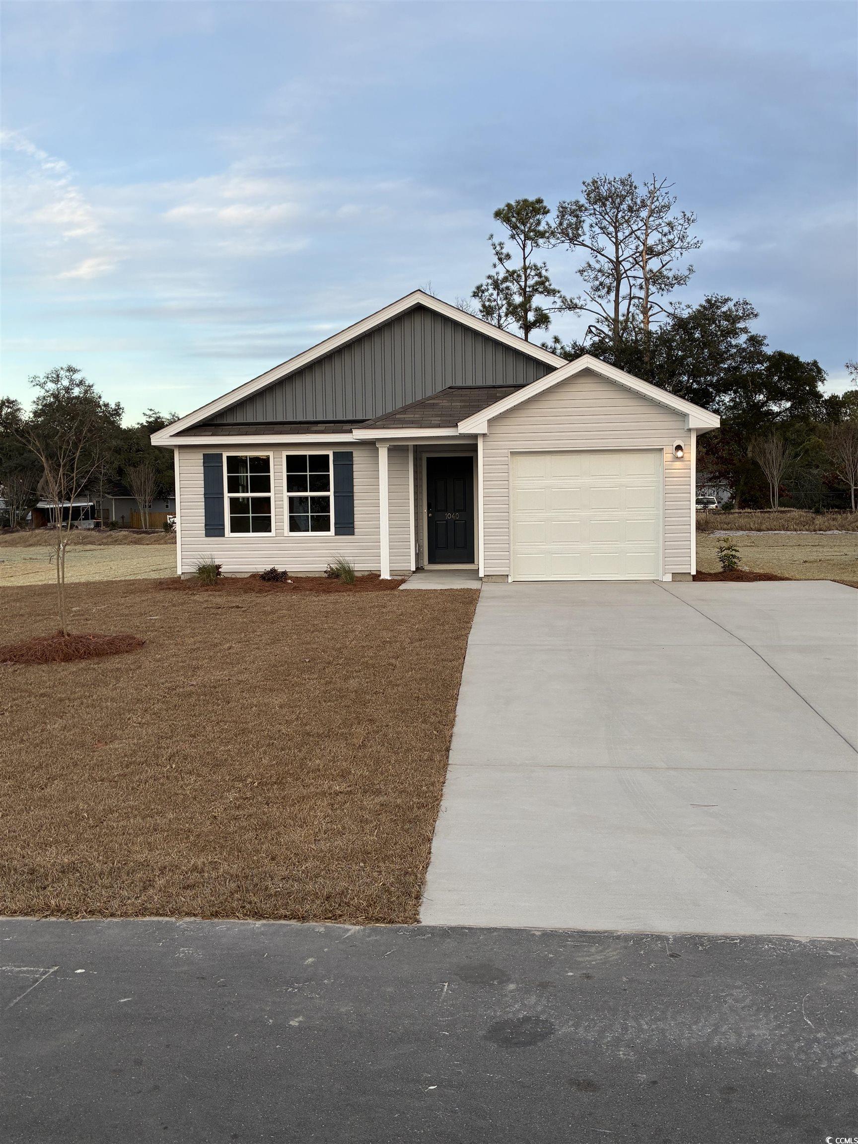 1040 Southwest Maple Vw Road Supply, NC 28462 - Photo 1 of 3 Ranch-style home featuring concrete driveway and a garage
