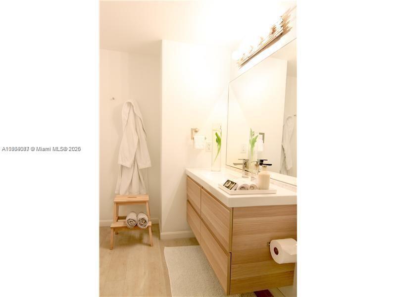 1250 South Miami Avenue, Unit 901 Miami, FL 33130 - Photo 10 of 10 view of bathroom with a sink and mirror