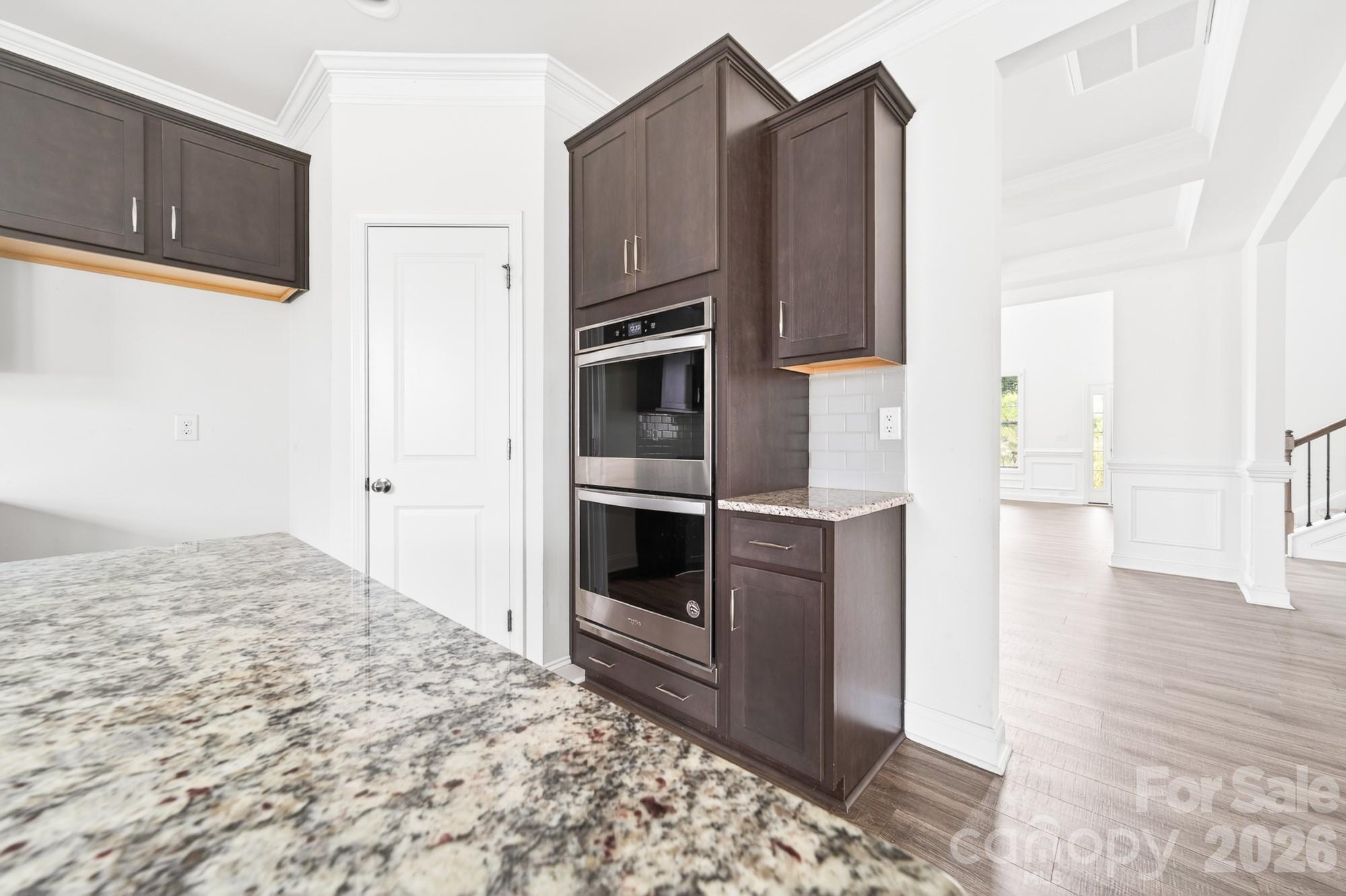 5972 Redwood Pine Road Concord, NC 28027 - Photo 12 of 37 a bedroom with a bed and cabinets