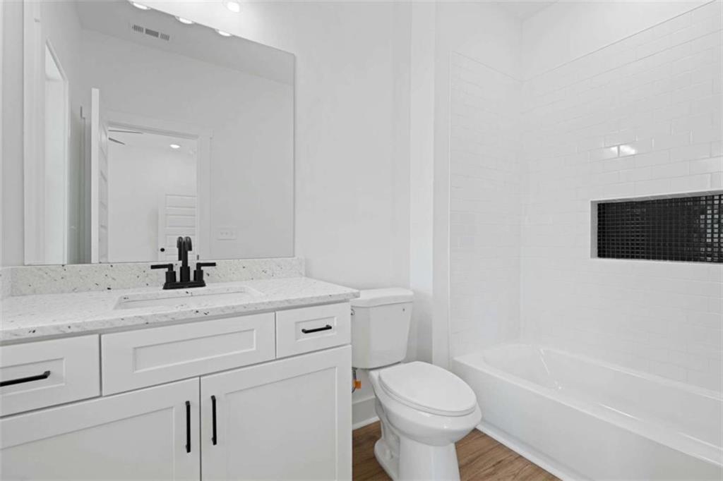 11691 Hazelbrand Road Northeast Covington, GA 30014 - Photo 22 of 53 a bathroom with a sink a toilet and a bathtub