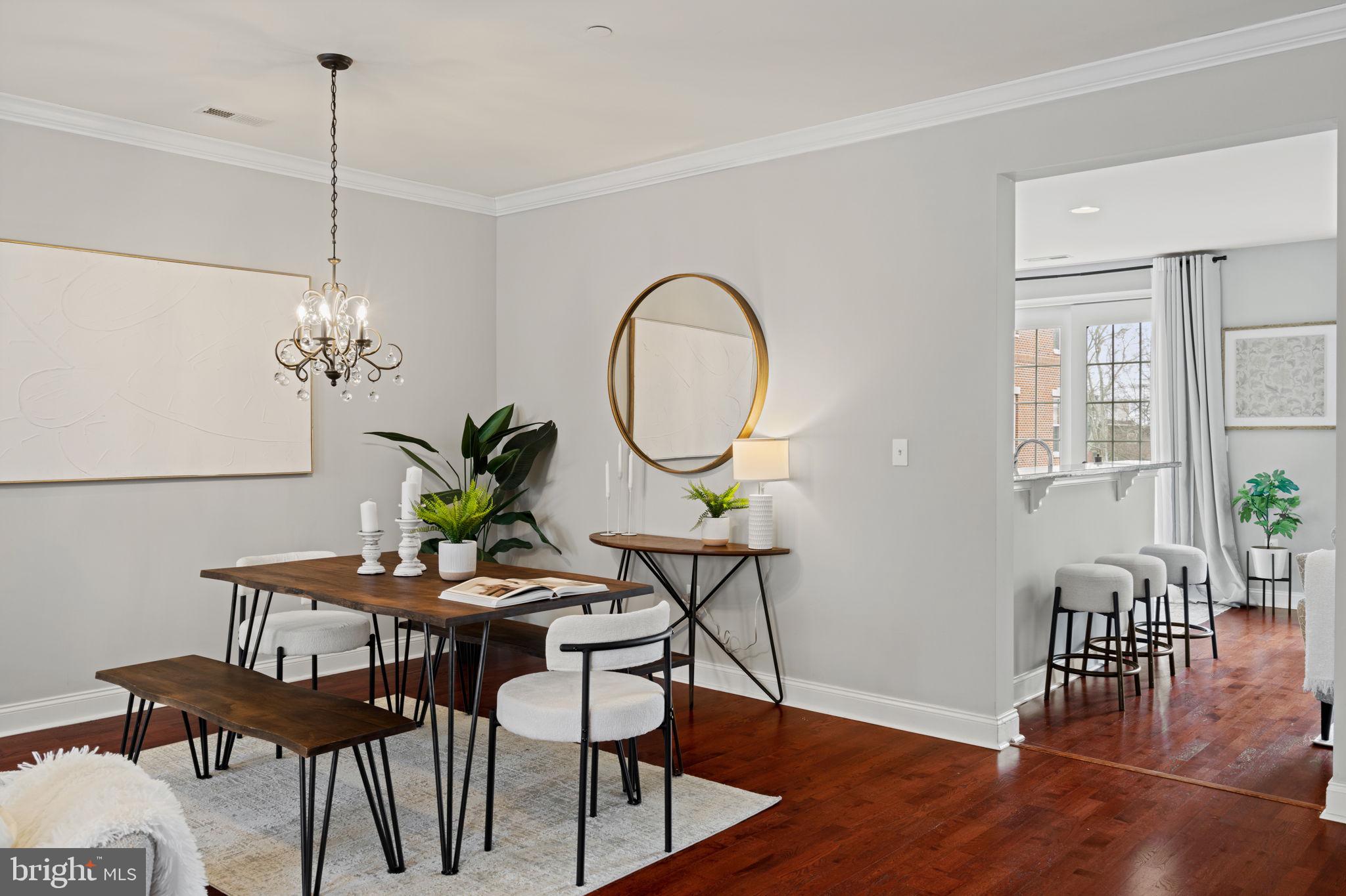 305 Captains Way Philadelphia, PA 19146 - Photo 12 of 63 a dining room with furniture potted plants and wooden floor