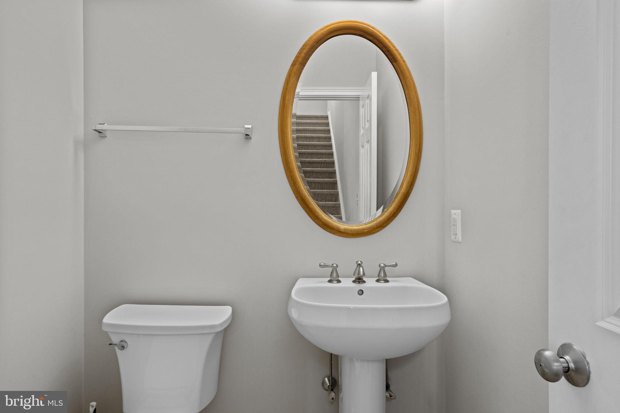 305 Captains Way Philadelphia, PA 19146 - Photo 14 of 63 a bathroom with a sink a mirror and a toilet