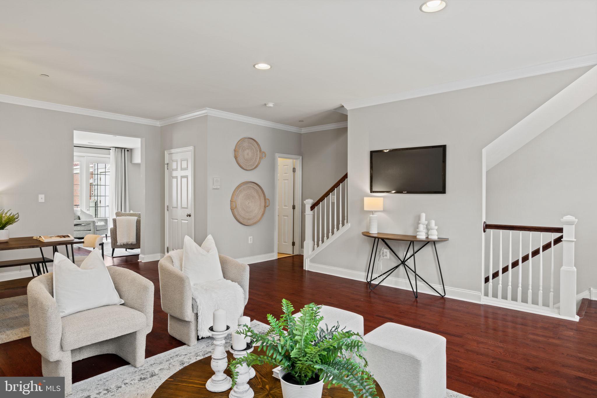 305 Captains Way Philadelphia, PA 19146 - Photo 4 of 63 a living room with furniture a flat screen tv and kitchen view