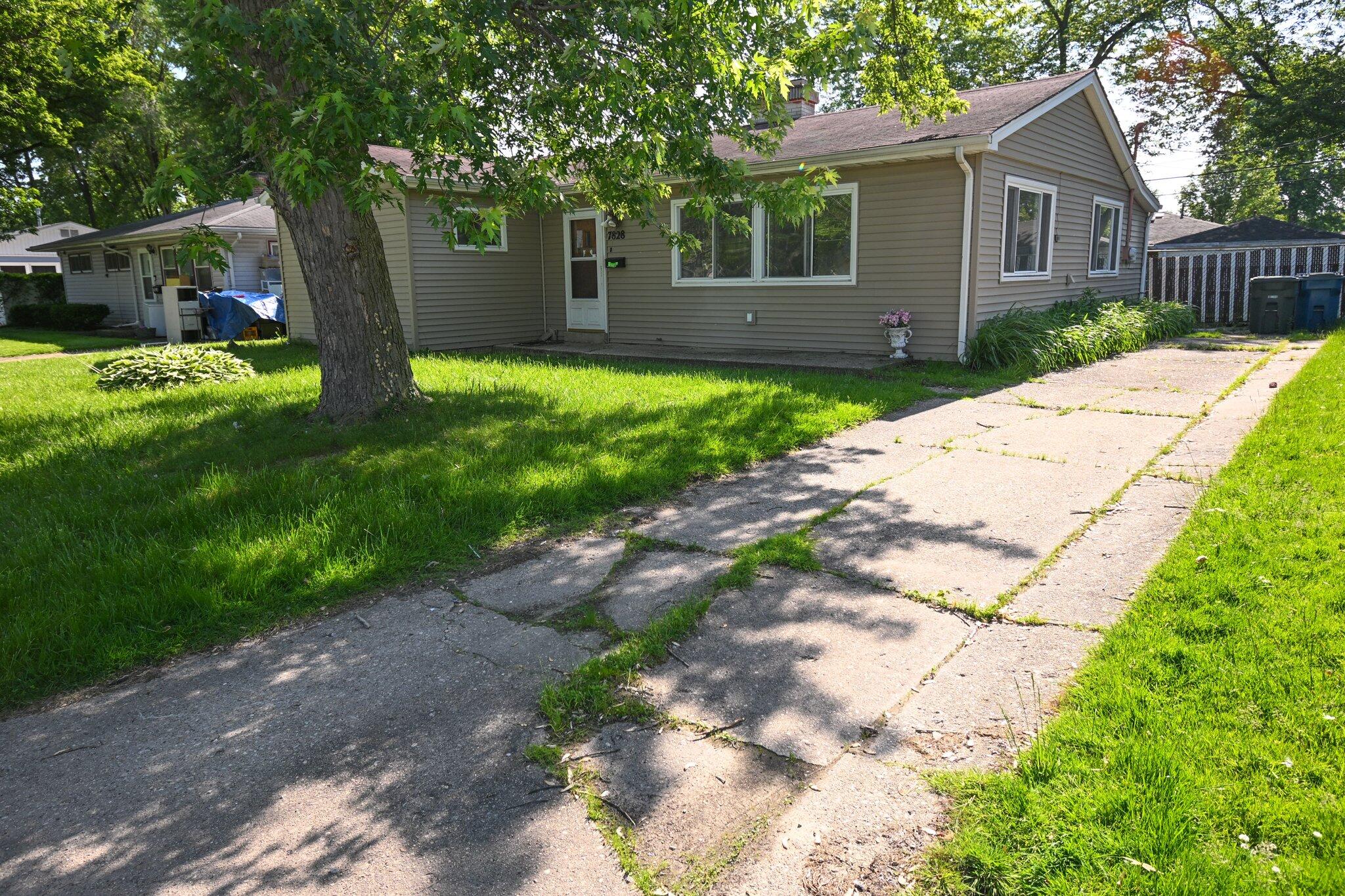 7828 Chestnut Avenue Hammond, IN 46324 - Photo 23 of 23 a view of a house with a yard