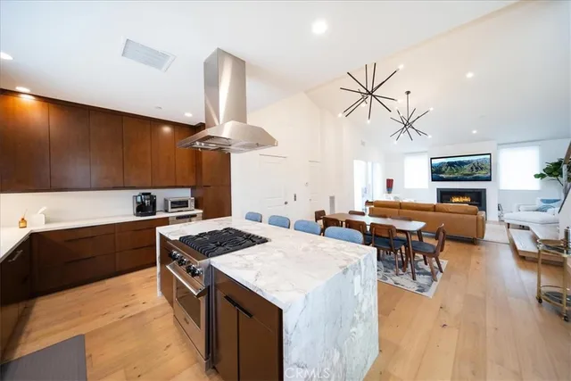 a kitchen with a stove a sink and a refrigerator